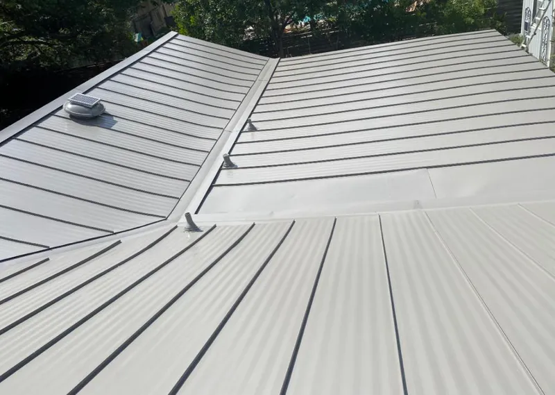 Solar attic fan installed on a metal roof for Roof Ventilation in Plaistow